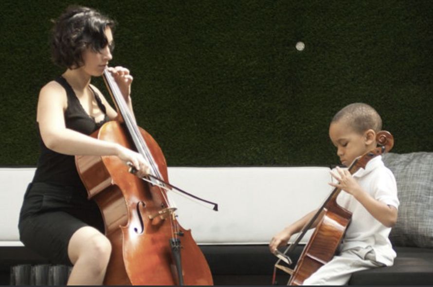 Chicago cello teacher Veronica Kolegas working with student